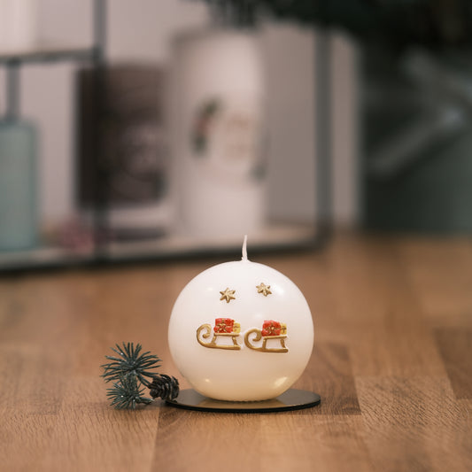 Weihnachtskerze mit Schlitten und Stern